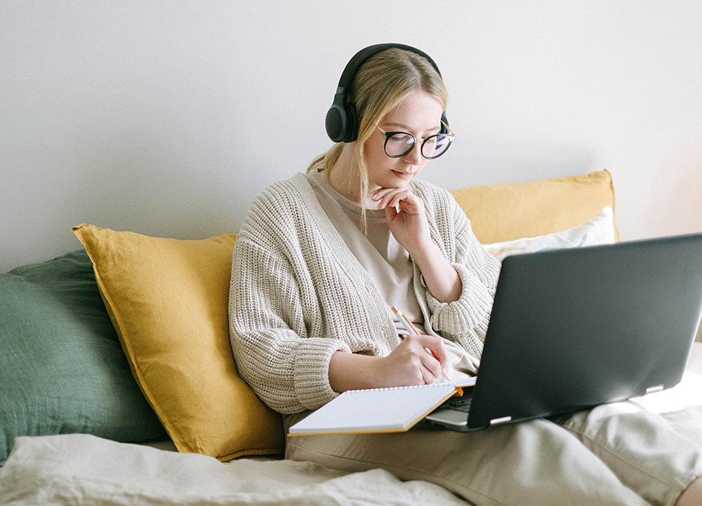 Woman video calling on laptop